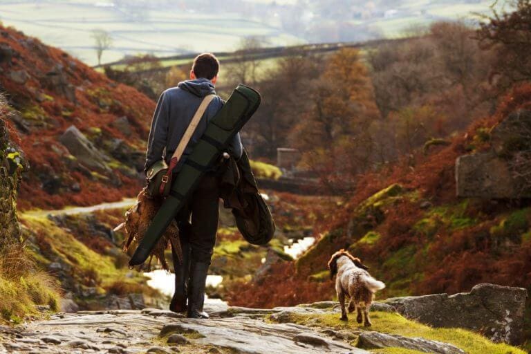 A hunter and and his dog