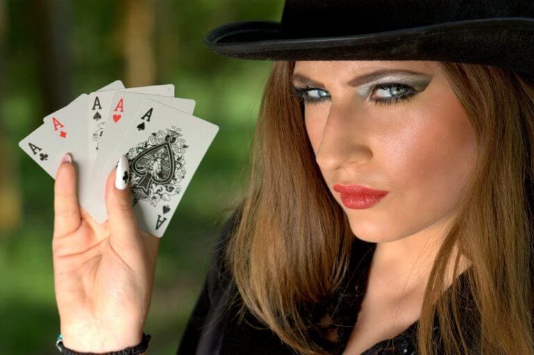 A girl holding playing cards