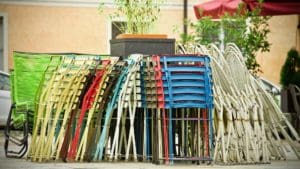 Stacked chairs at an outdoor event