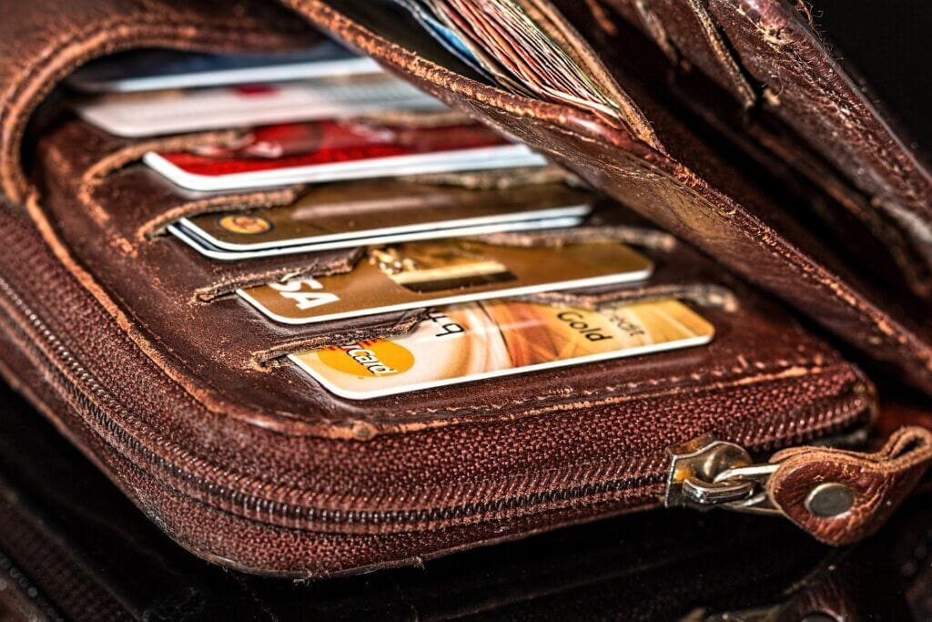 A wallet holding many credit cards