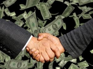 Shaking hands on a financial agreement