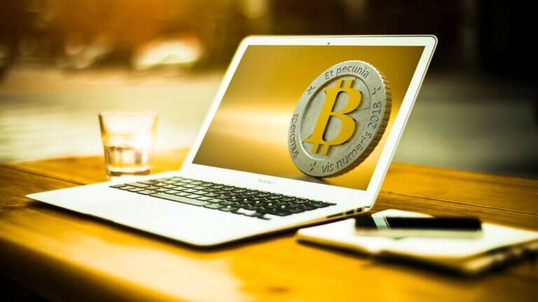 A Bitcoin symbol on a laptop screen