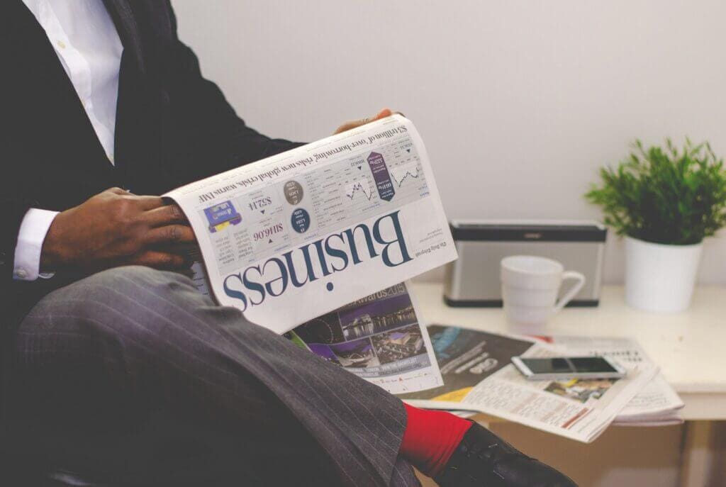 A businessman reading a business newspaper