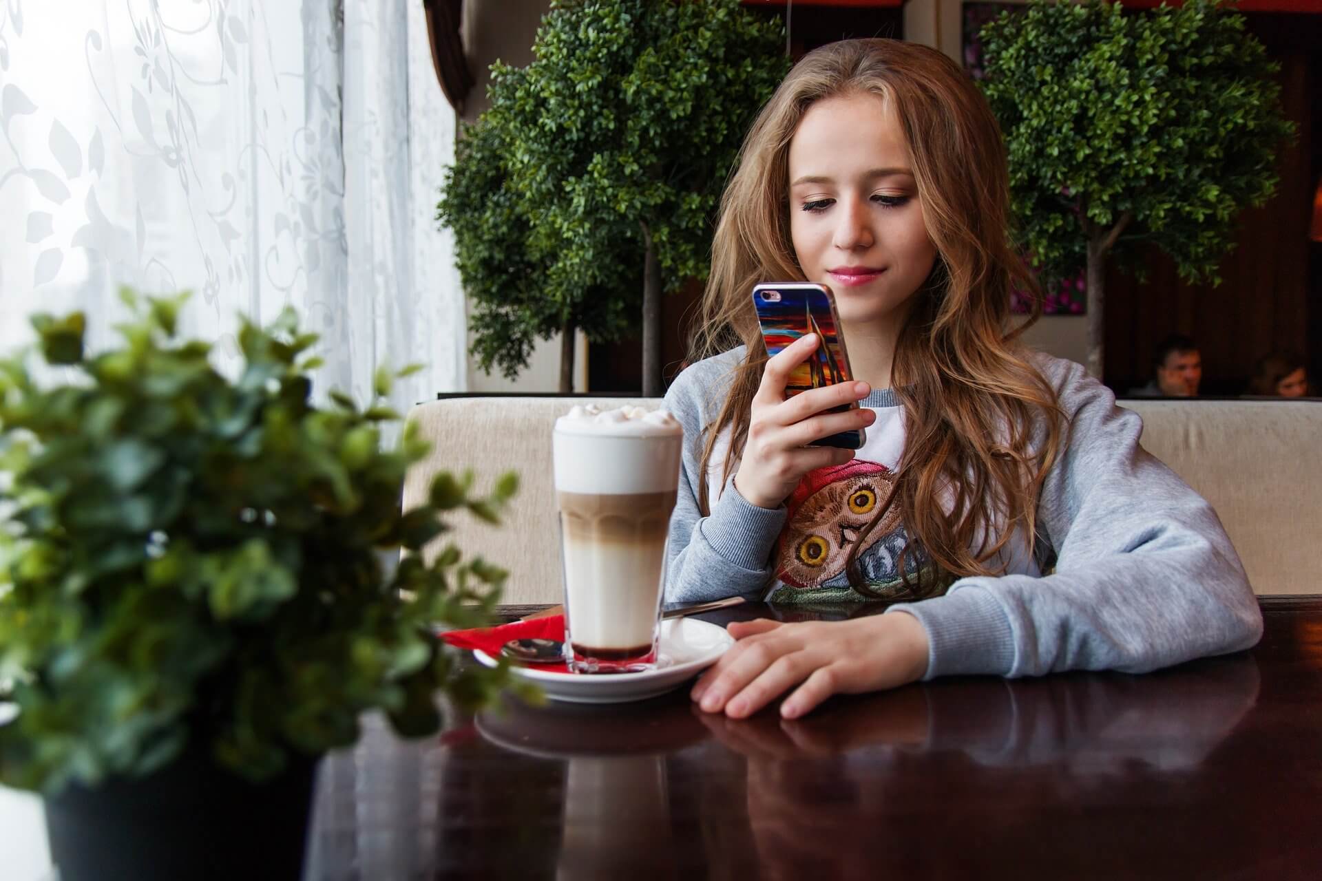 A teenage girl using her smartphone.