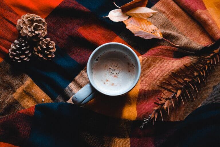 A cup of coffee and fall decorations