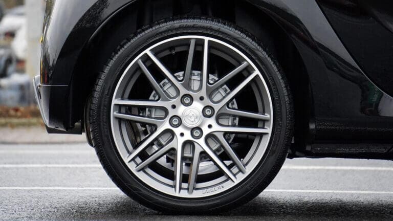 A car wheel and tyre on a secondhand car - tyres contributing to car running costs