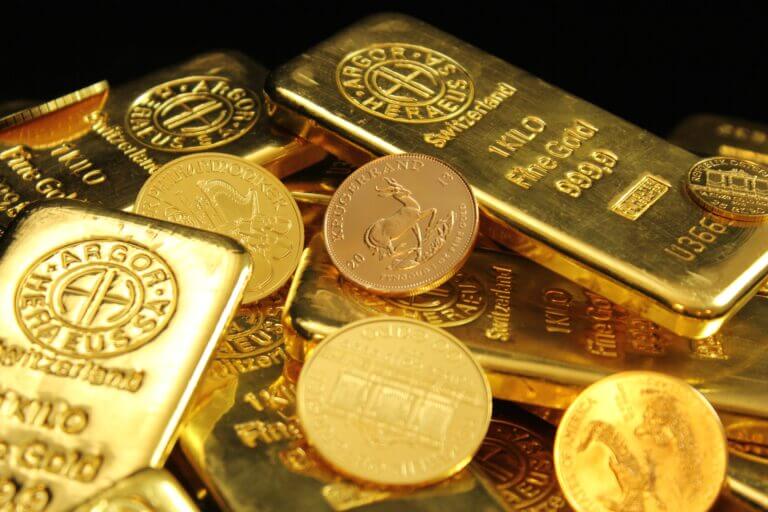 Gold bars and Kruggerand coins