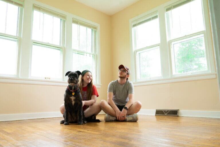 A couple and their dog in their new home