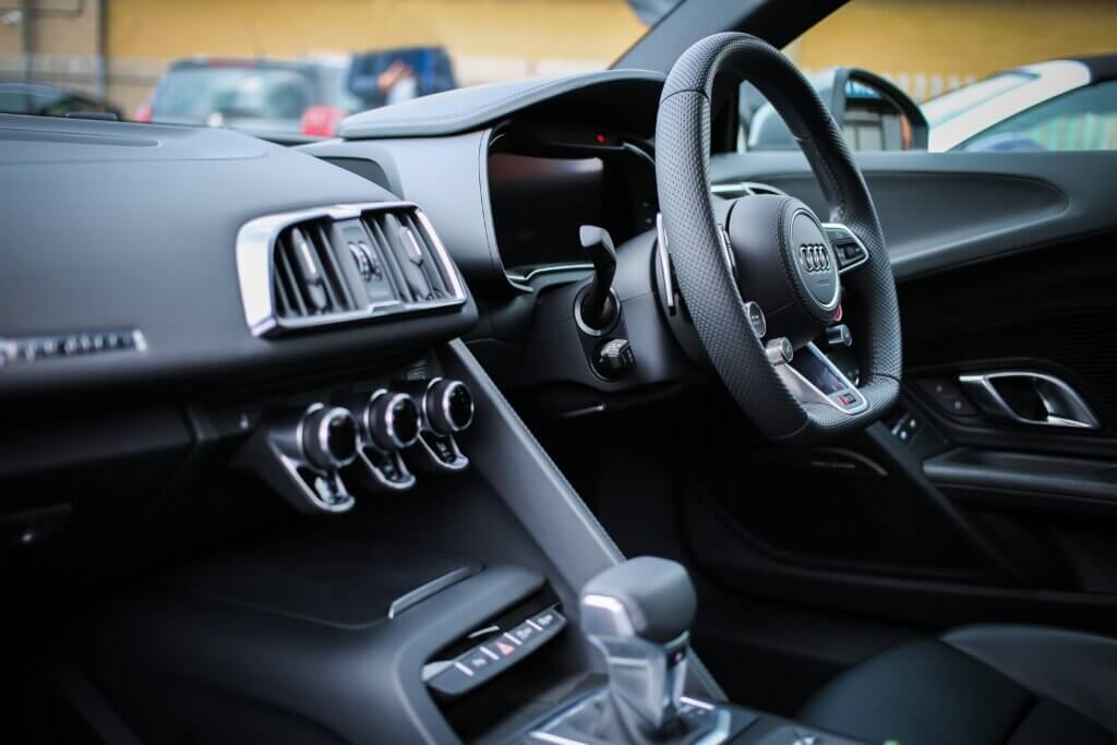 car inside black leather steering wheel