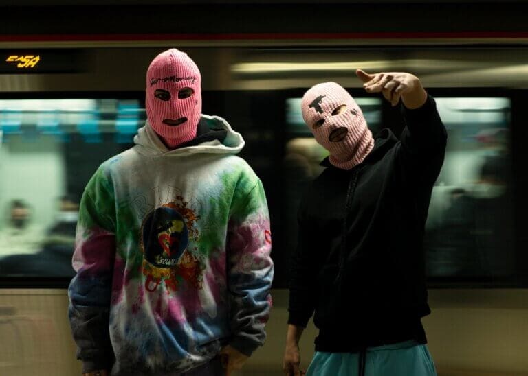 Masked criminals at a train station