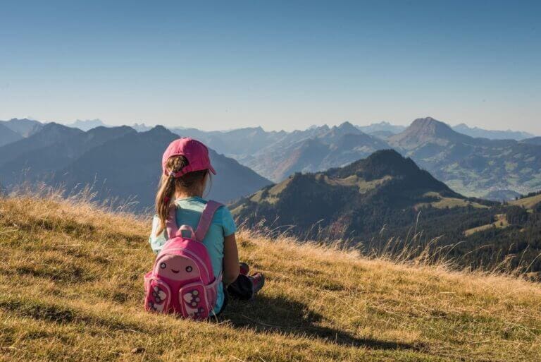 A school girl looking at mountains