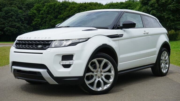 white car parked range rover - consider car running costs