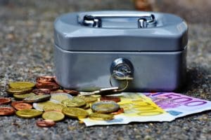 A cash box and coins